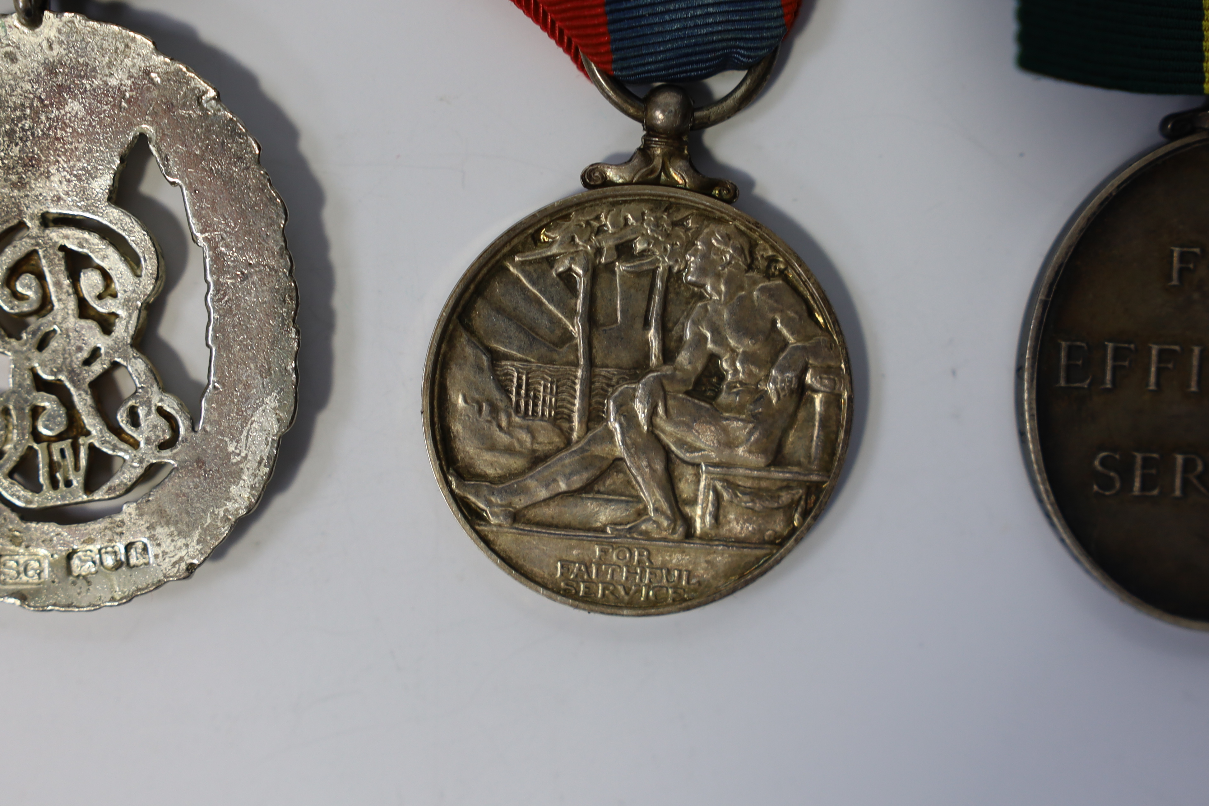 Three assorted service medals; Ed VII Volunteer Officer's Decoration hallmarked for 1905; GV Imperial Service medal to Walter Charles Cornish; GVI Territorial Efficiency medal to 2062789 . S/Sgt. L.W.Sergeant. R.A. Condi